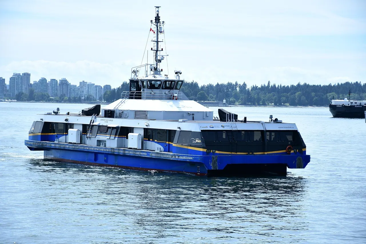 a ferry boat, passenger boat, waterfront ferry boat