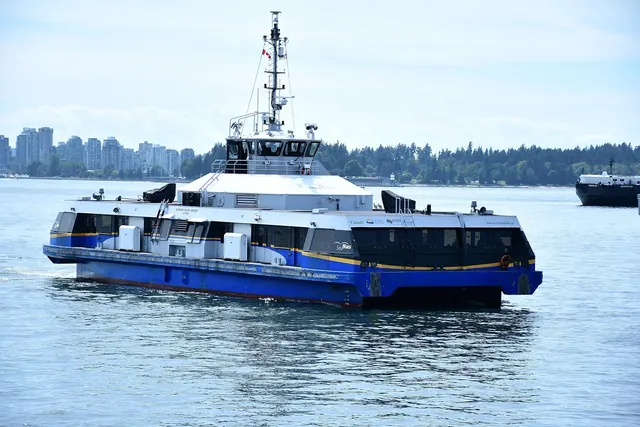 a ferry boat, passenger boat, waterfront ferry boat